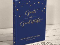 dark navy blue traditional baby shower guest book with gold stars across the top the cover is personalized with name and shower date and reads "guests and good wishes"