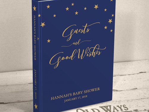 dark navy blue traditional baby shower guest book with gold stars across the top the cover is personalized with name and shower date and reads "guests and good wishes"